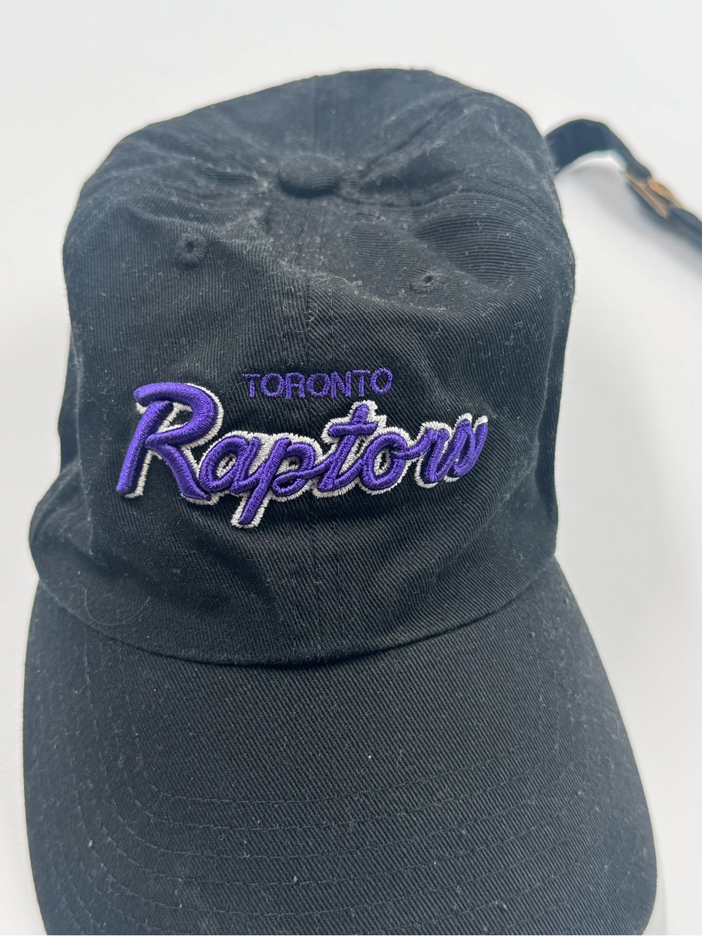 Toronto Raptors Black Baseball Cap with Purple Script